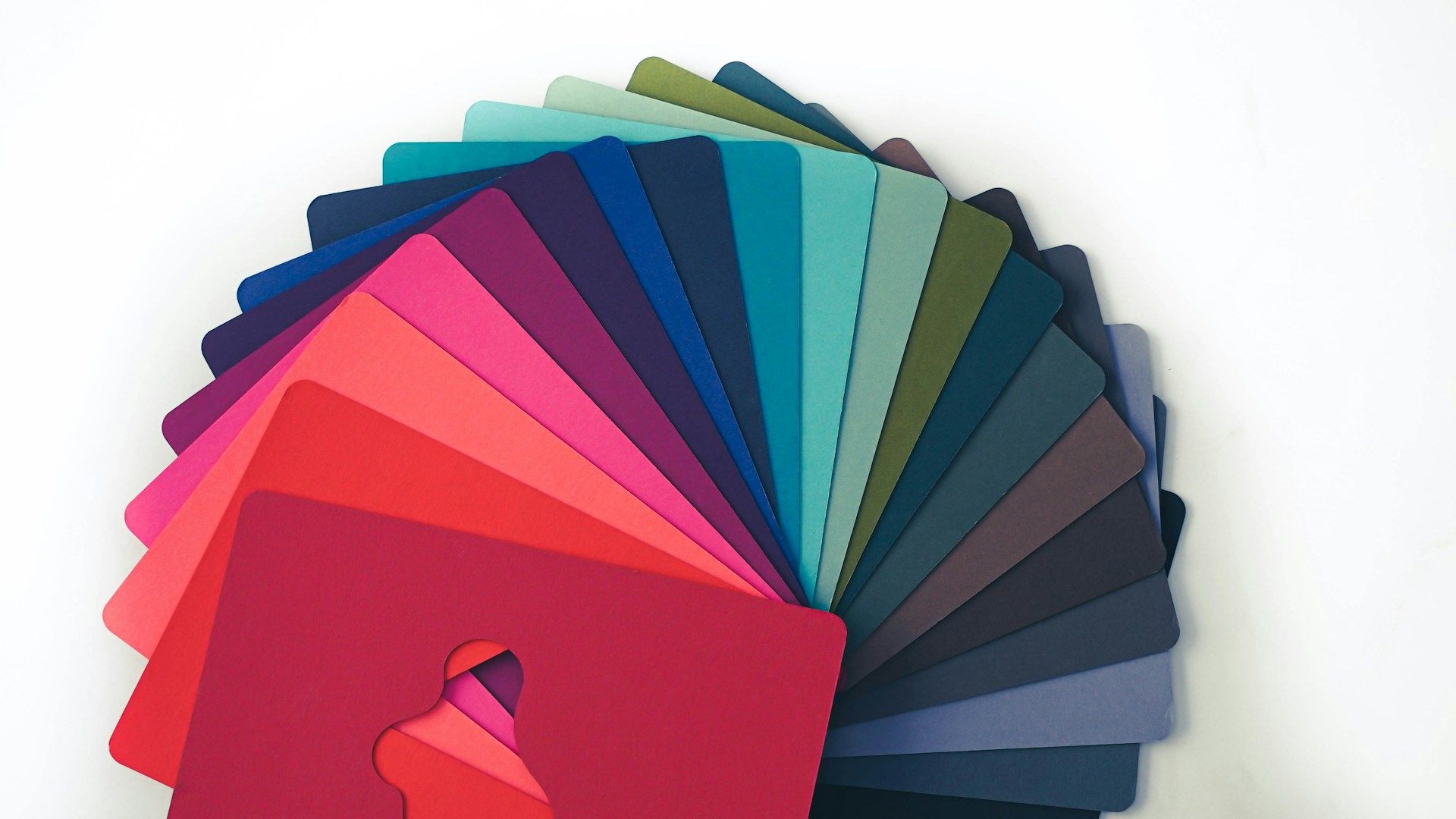 A fan of coloured cards to help designers choose a palette for a project