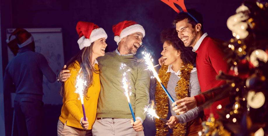 A group of friends with sparklers around Christmas and New Years time