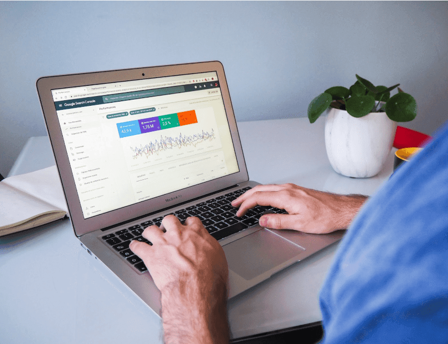 A business owner looking at the analytics of their website on their computer