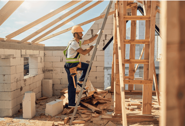 A construction worker hard at work in a house development project
