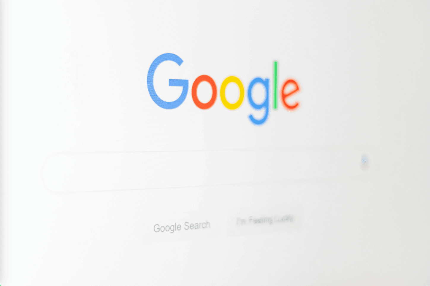 A blurry view of the Google web browser interface, with indistinct text and icons creating a soft, out-of-focus effect.
