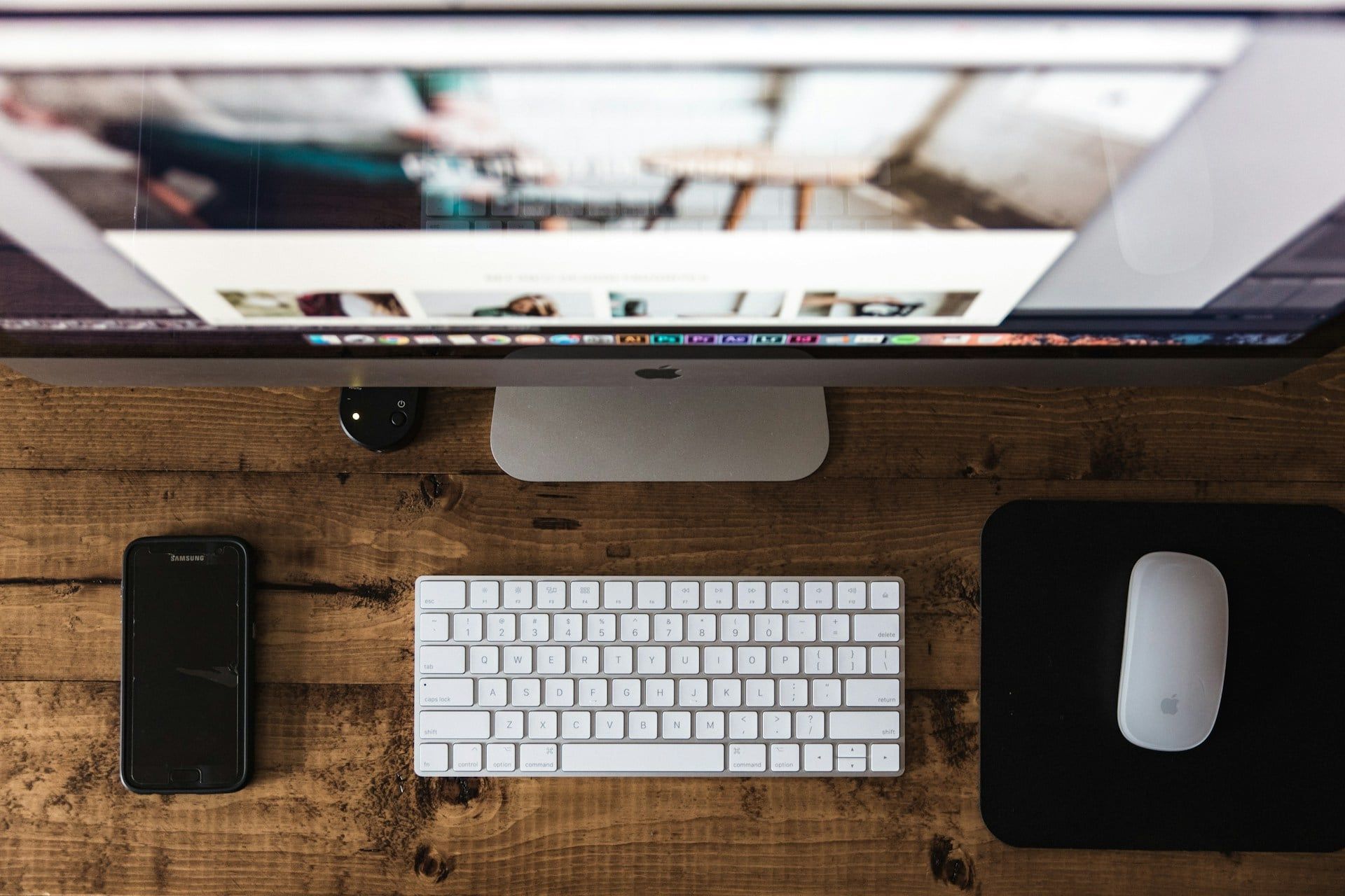 A top-down view of a Mac computer setup for a web designer