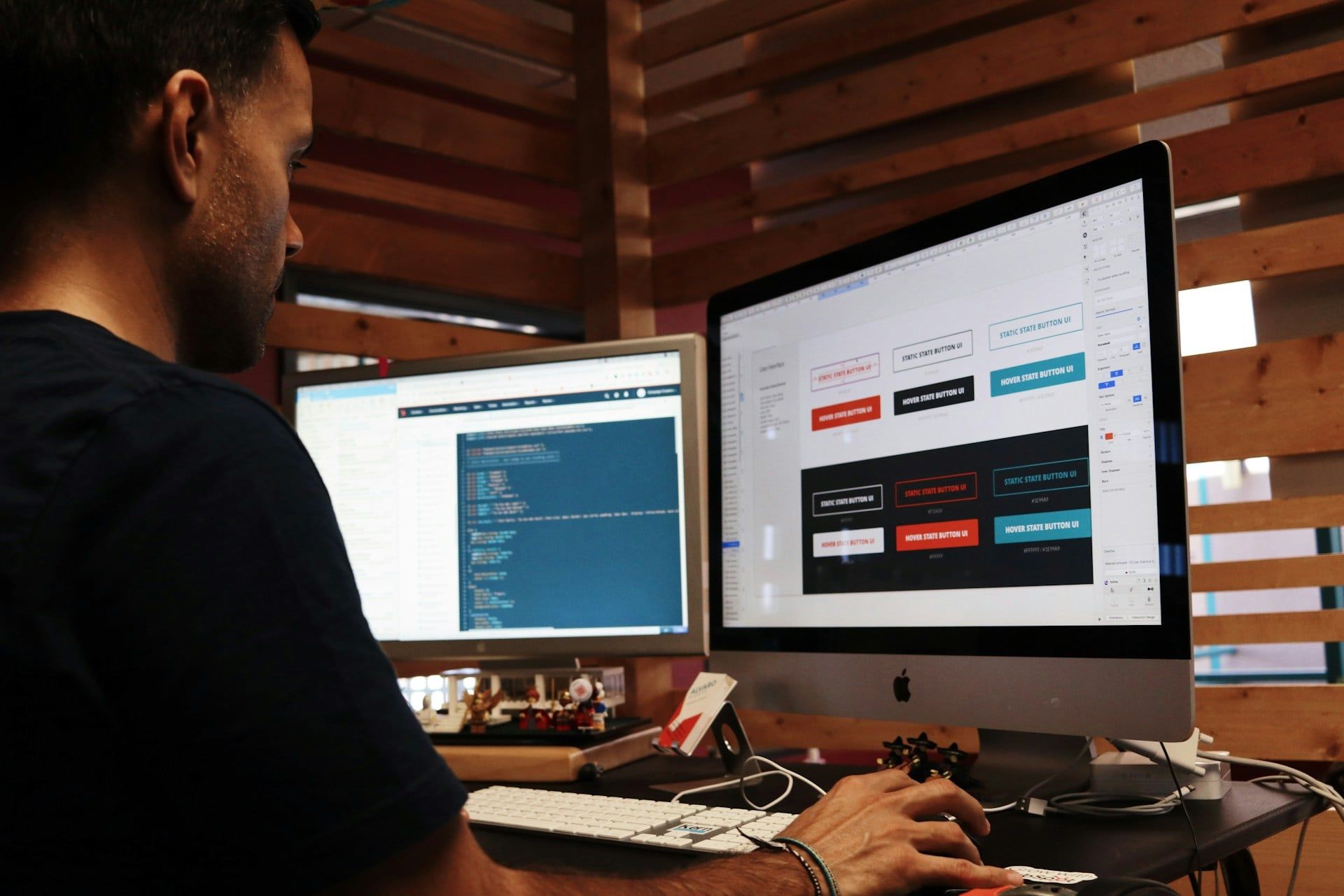 A man sits in his office building his website with code
