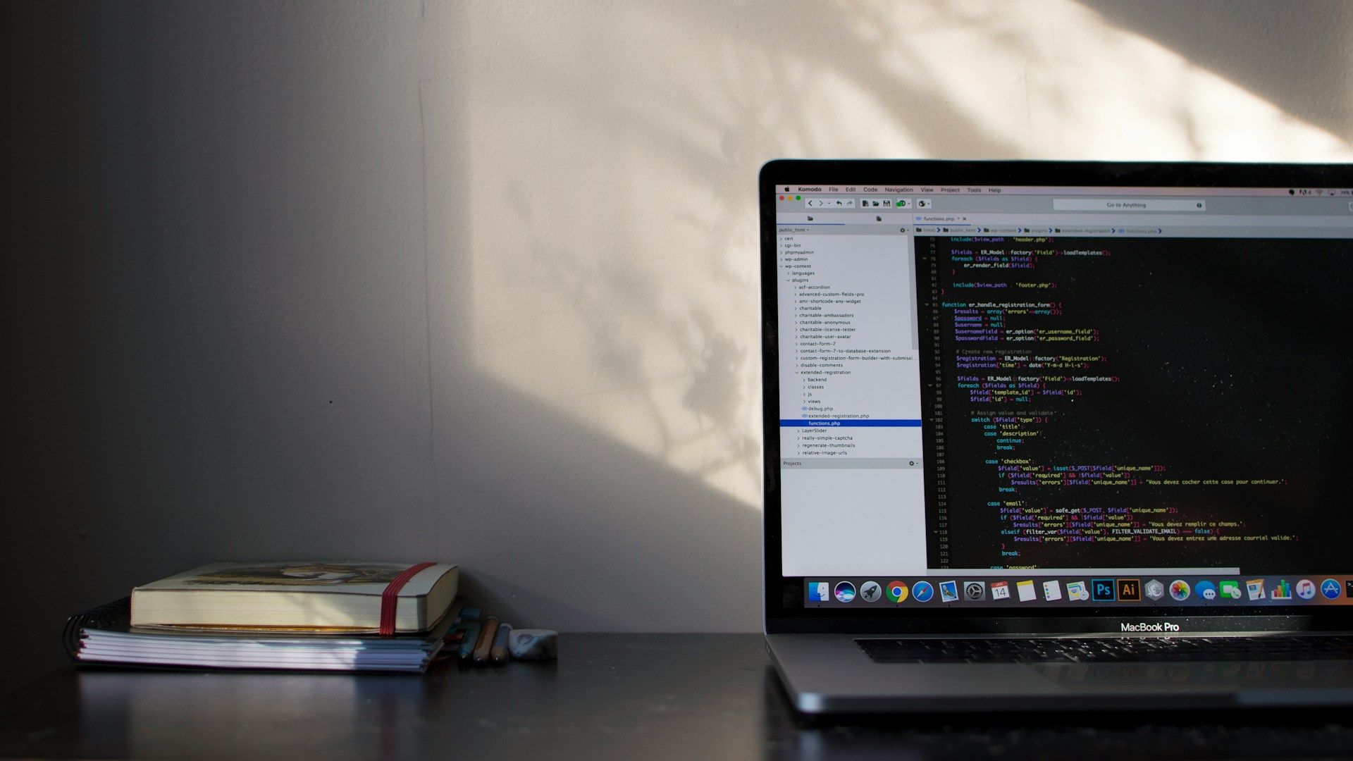 An aesthetic desk with a laptop displaying a coding website