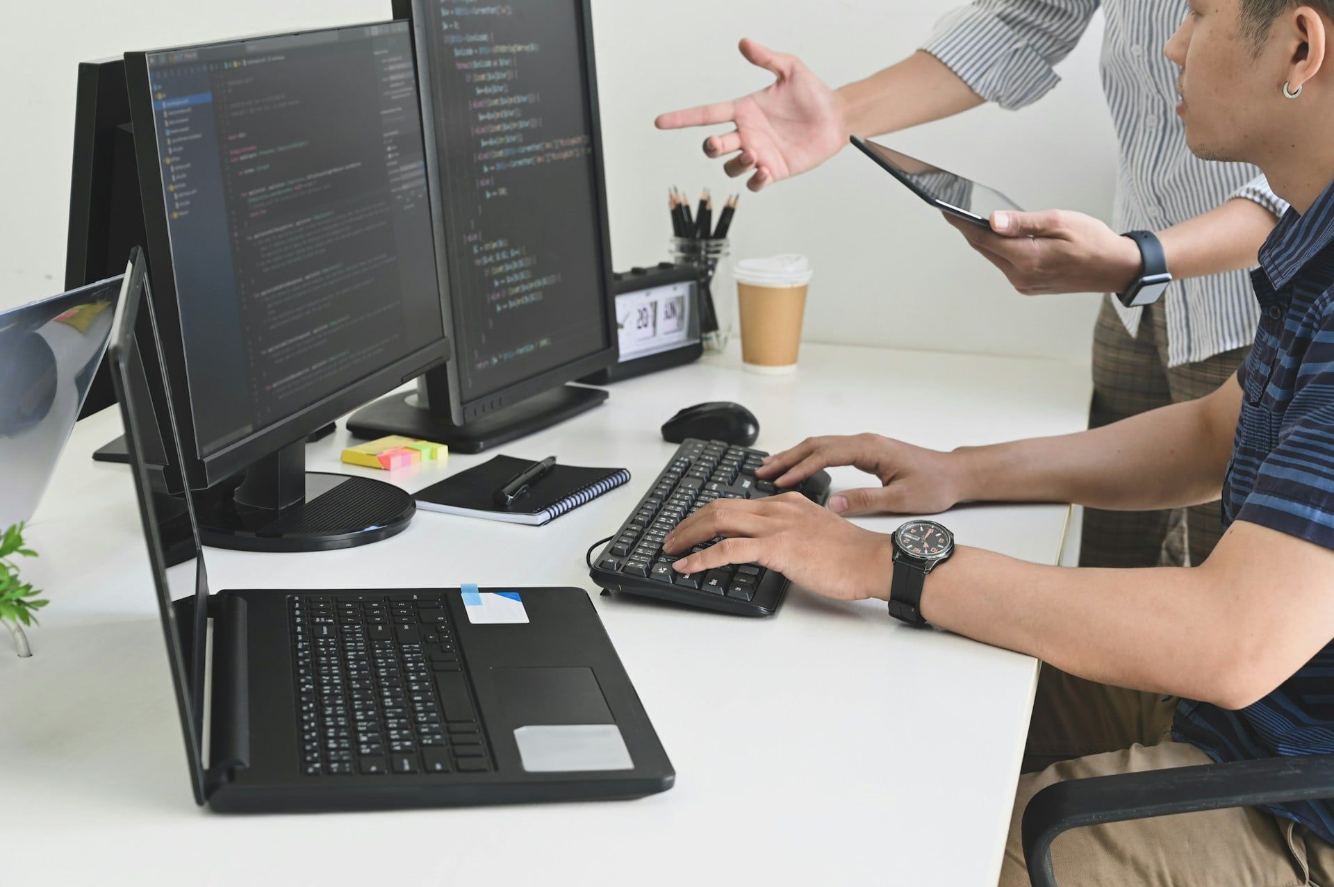  A web design team working on coding a new website