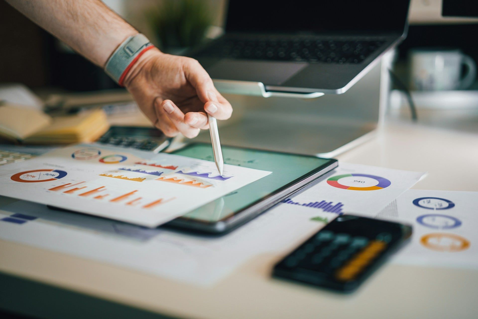 A desk full of documents displaying website analytics
